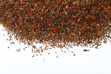 Dry rooibos tea leaves as texture for background. Toned.の写真素材