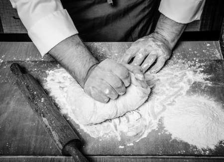 The process of making home bread by male hands. Toned.の写真素材
