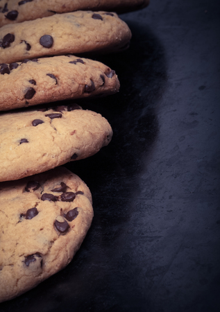 American cookies with chocolate drops on a black background. Toned.の写真素材