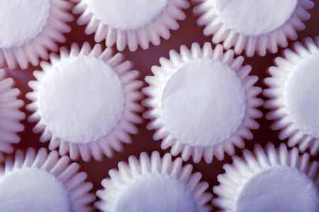 White paper forms for chocolates or cupcakes. Toned.の写真素材