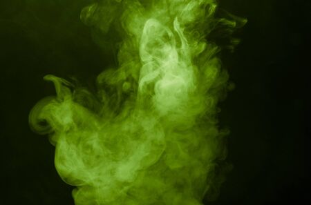 Cloud of smoke on black background. Selective focus. Toned.の写真素材