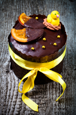 Easter cake on a wooden table. Toned.
