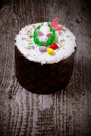 Easter cake on a wooden table. Toned.