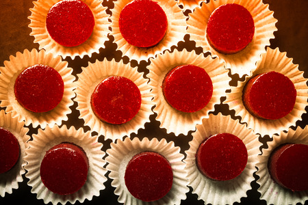 Berry jelly candy on the black table. Toned.