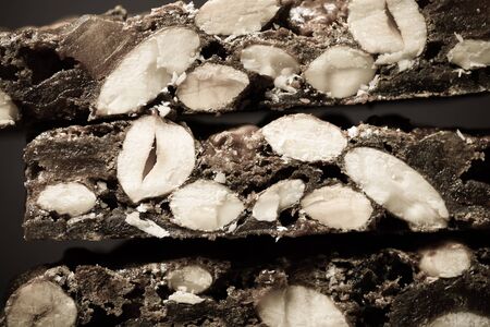 Traditional italian christmas dessert Panforte on dark background. Selective focus. Shallow depth of...