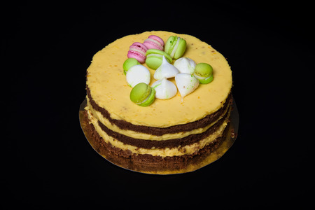 Chocolate homemade cake on black background. Toned.