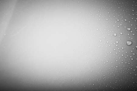 Drops of water on a color background. Gray. Shallow depth of field. Selective focus. Toned.の写真素材