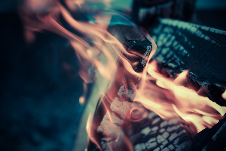 Bright flame of bonfire. Defocused. Toned.の写真素材