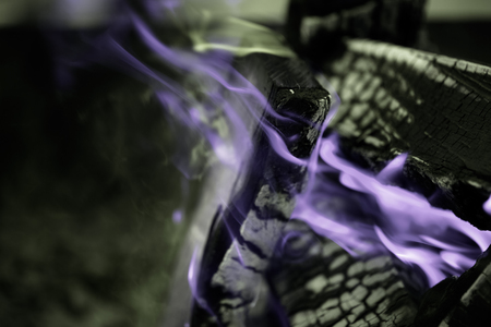 Bright flame of bonfire. Defocused. Toned.の写真素材