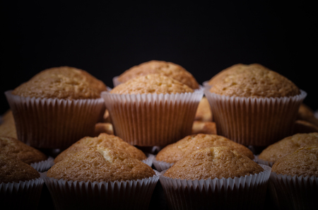 Fresh cupcake desert before decoration. Selective focus. Shallow depth of field. Toned.の写真素材
