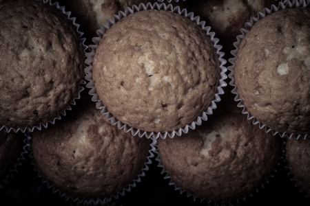 Fresh cupcake desert before decoration. Selective focus. Shallow depth of field. Toned.の写真素材
