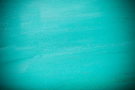 Painted wooden cutting board for background. Toned.