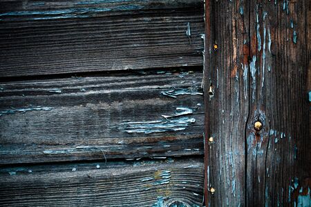 The old wooden houses painted wall. Closeup view. Selective focus. Toned.の写真素材
