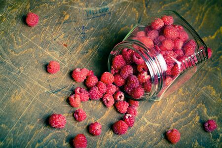 Lots of fresh bright red raspberries. Selective focus.の写真素材