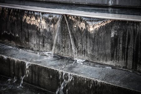 Fountain with stages for water. Selective focus. Toned.の写真素材