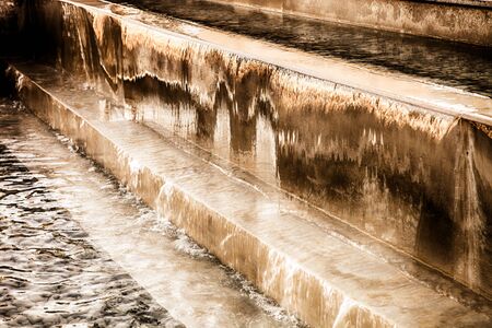 Fountain with stages for water. Selective focus. Toned.の写真素材