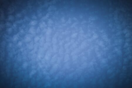 White clouds on a blue sky. Selective focus. Toned.の写真素材