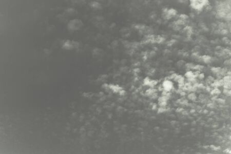 White clouds on a blue sky. Selective focus. Toned.の写真素材