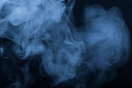 Cloud of smoke on black background. Selective focus. Toned.の写真素材