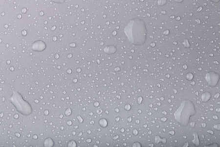 Drops of water on a color background.