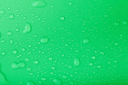 Drops of water on a color background. Toned.の写真素材