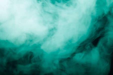 Cloud of smoke on black background. Selective focus. Toned.の写真素材