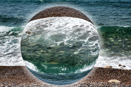 Wave on the pebble coast of sea.