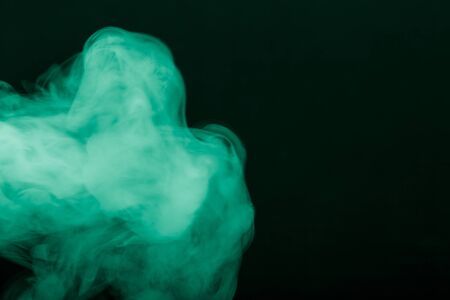 Cloud of smoke on black background. Selective focus. Toned.の写真素材