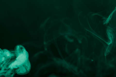 Cloud of smoke on black background. Selective focus. Toned.の写真素材