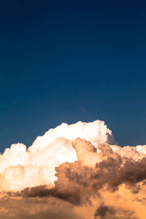 Blue sky with white clouds like a mountain. Toned.の写真素材
