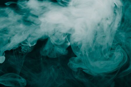 Cloud of smoke on black background. Selective focus. Toned.の写真素材