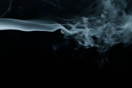 Cloud of smoke on black background. Selective focus. Toned.の写真素材
