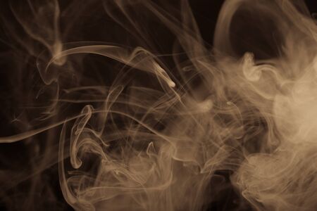 Cloud of smoke on black background. Selective focus. Toned.の写真素材