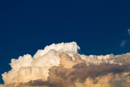 Blue sky with white clouds like a mountain. Toned.