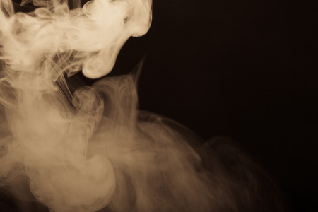 Cloud of smoke on black background. Selective focus. Toned.の写真素材