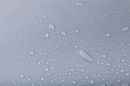 Drops of water on a color background.の写真素材