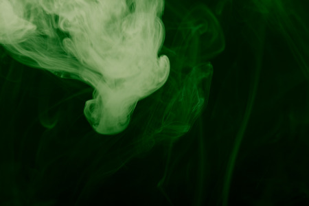 Cloud of smoke on black background. Selective focus. Toned.の写真素材