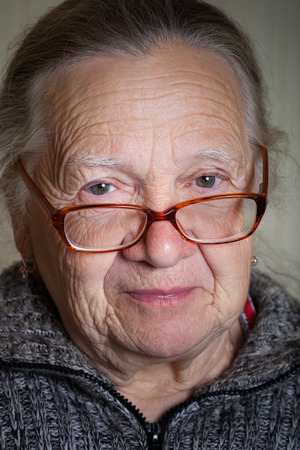Portrait of elderly woman in glasses. Toned.の写真素材