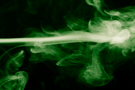 Cloud of smoke on black background. Selective focus. Toned.の写真素材