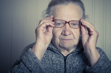 Portrait of elderly woman in glasses. Toned.の写真素材