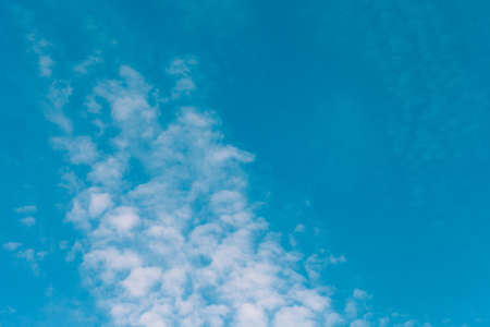 White clouds on a blue sky. Selective focus. Toned.の写真素材
