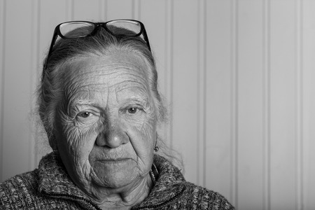 Portrait of elderly woman in glasses. Toned.の写真素材