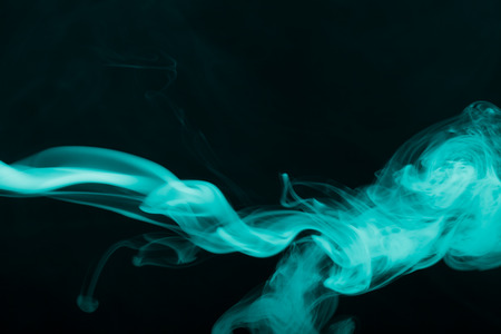 Cloud of smoke on black background. Selective focus. Toned.の写真素材