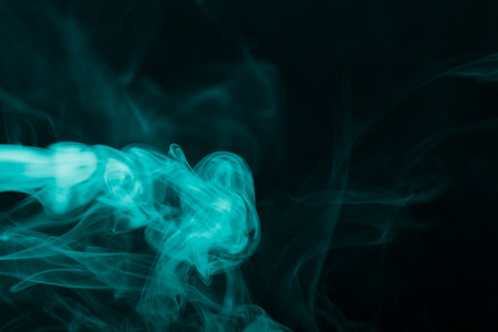 Cloud of smoke on black background. Selective focus. Toned.の写真素材