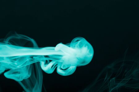 Cloud of smoke on black background. Selective focus. Toned.の写真素材