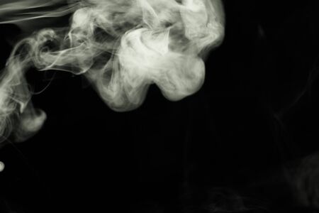 Cloud of smoke on black background. Selective focus. Toned.の写真素材