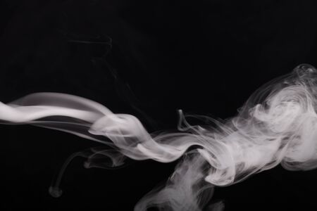 Cloud of smoke on black background. Selective focus.の写真素材