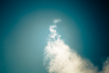 White clouds on a blue sky. Selective focus. Toned.の写真素材