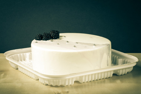 Homemade bright mousse cake with mirror glaze. Toned.の写真素材