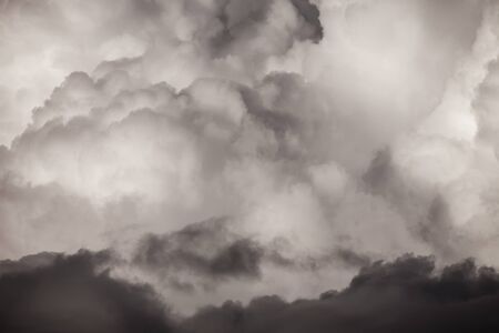 Blue sky with white cumulus clouds. Toned.の写真素材